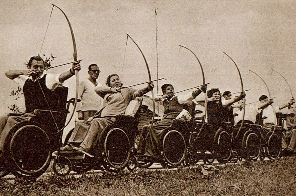 Paralympic Games history: Wheelchair athletes competing in archery at the 1948 Stoke Mandeville Games.