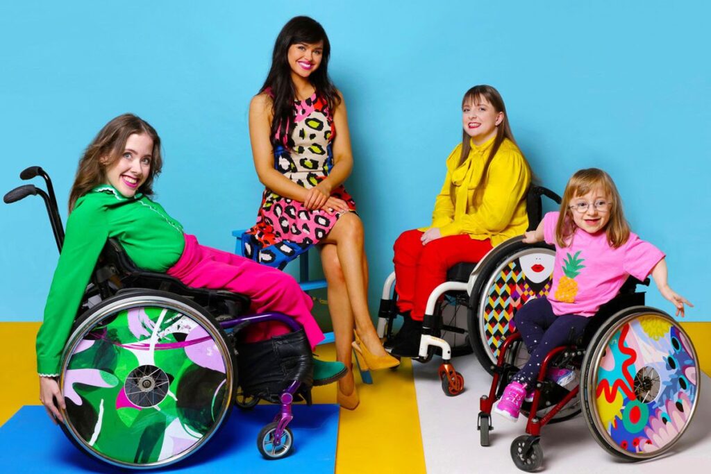girls in a wheelchair with customized spoke wards